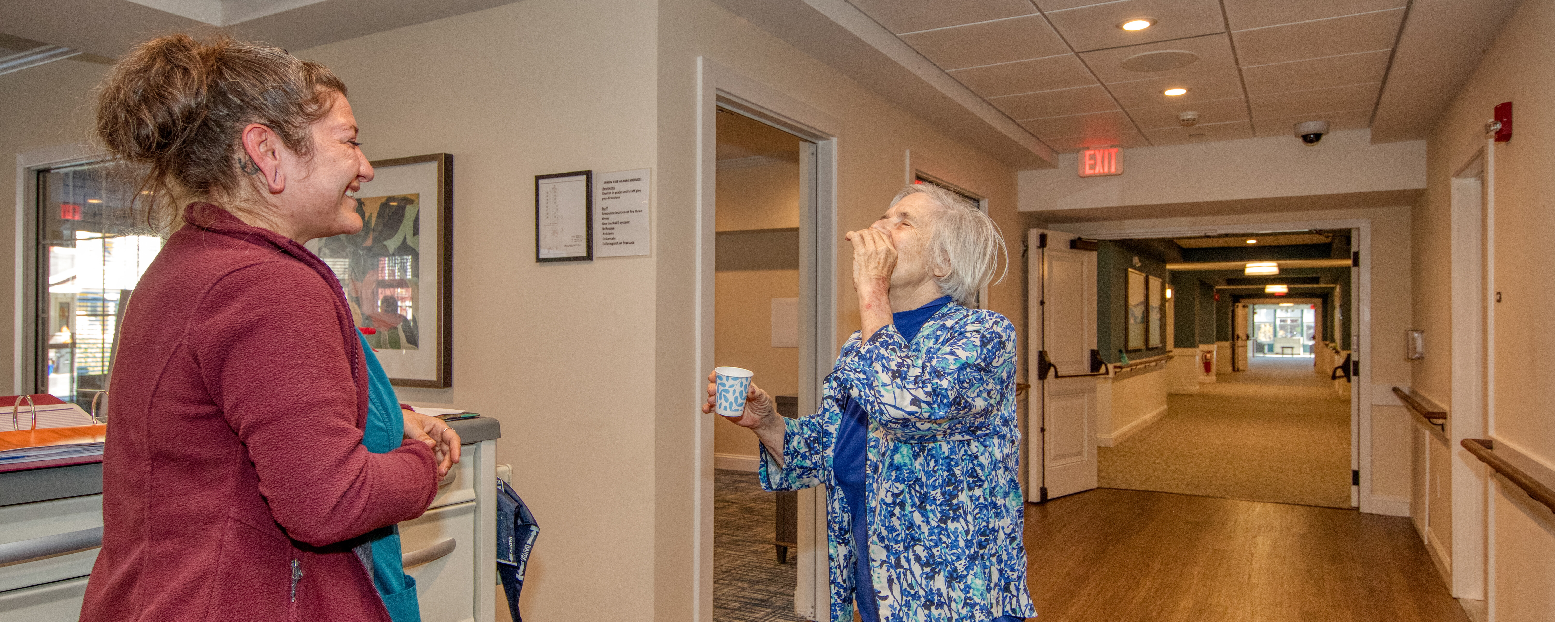 Female LPN reviewing medication before administering to a senior resident